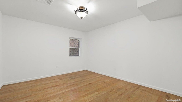 empty room with light wood-type flooring