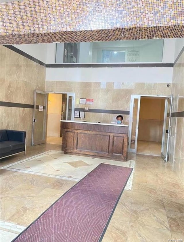 kitchen featuring tile walls