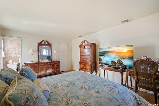 bedroom featuring hardwood / wood-style flooring