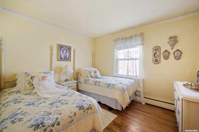 bedroom with light hardwood / wood-style flooring, baseboard heating, and ornamental molding