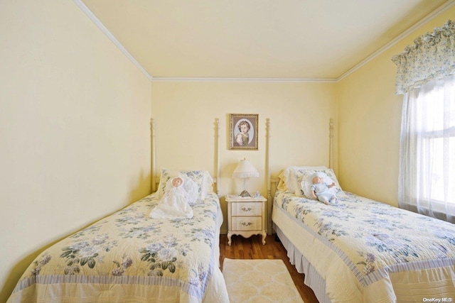 bedroom featuring hardwood / wood-style floors and ornamental molding