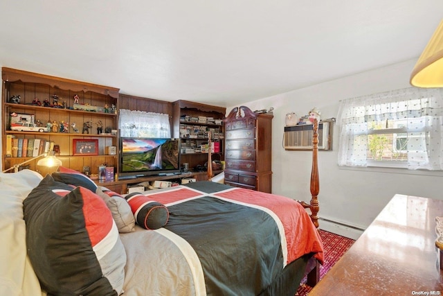 bedroom featuring a baseboard heating unit