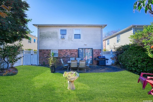 rear view of house with a lawn