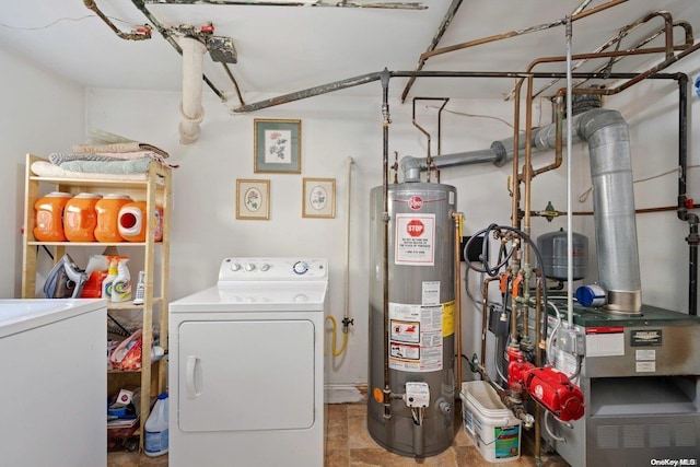 clothes washing area with gas water heater and washing machine and clothes dryer