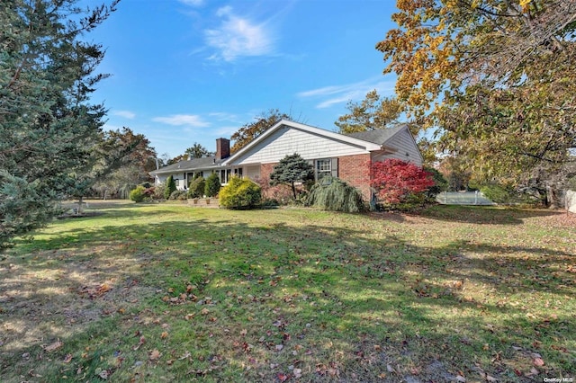 view of property exterior with a yard