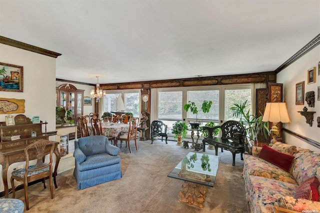 living room featuring a notable chandelier, crown molding, a healthy amount of sunlight, and carpet