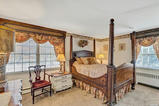 carpeted bedroom featuring radiator and baseboard heating