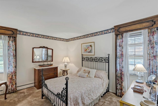 carpeted bedroom with baseboard heating