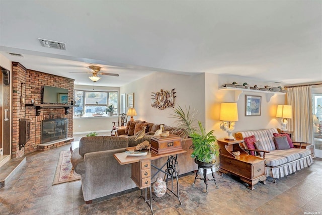 living room with ceiling fan and a brick fireplace