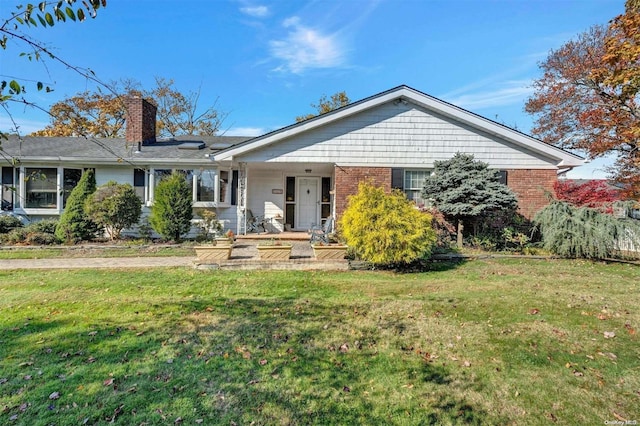 single story home with a front yard