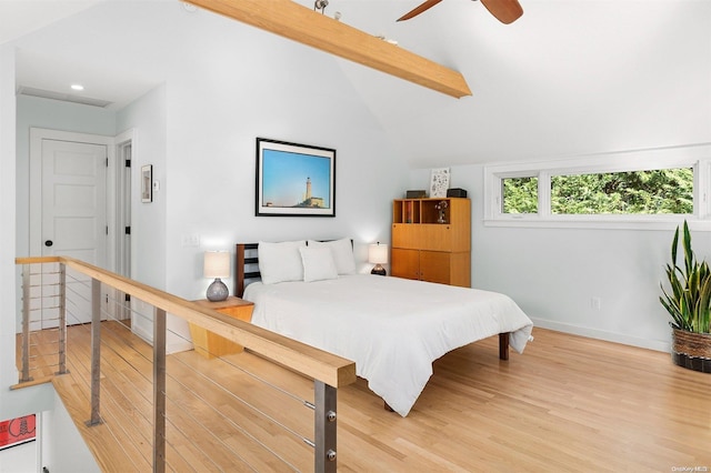 bedroom featuring vaulted ceiling with beams, ceiling fan, and hardwood / wood-style floors