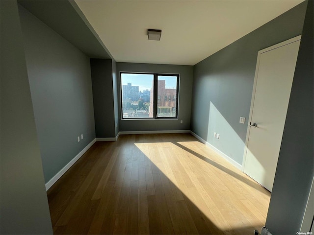 spare room featuring light hardwood / wood-style flooring