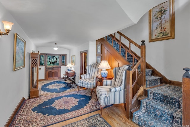 interior space featuring vaulted ceiling and hardwood / wood-style flooring