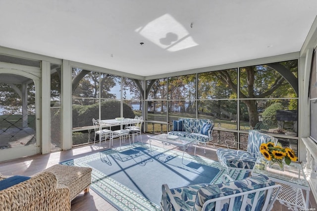 sunroom / solarium featuring a healthy amount of sunlight