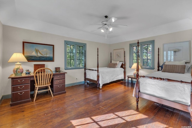 bedroom featuring ceiling fan and dark hardwood / wood-style flooring