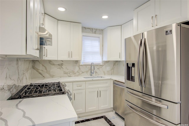 kitchen featuring white cabinetry, sink, and appliances with stainless steel finishes