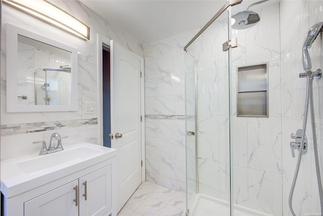 bathroom featuring an enclosed shower, tile walls, and sink