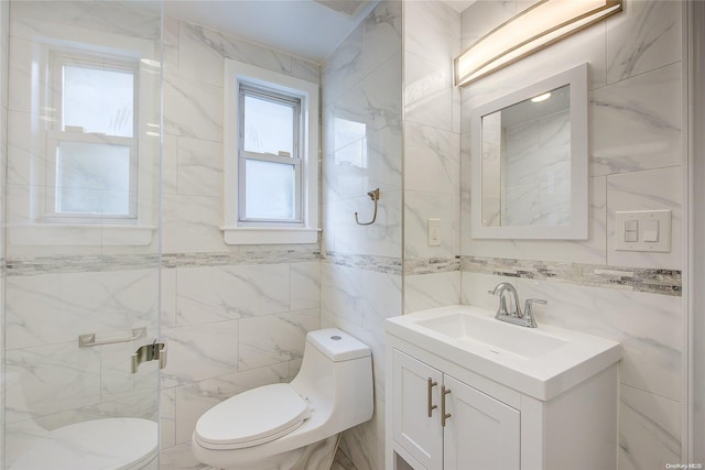 bathroom featuring vanity, toilet, and tile walls