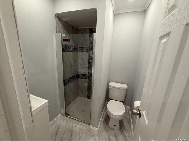 bathroom featuring toilet and walk in shower