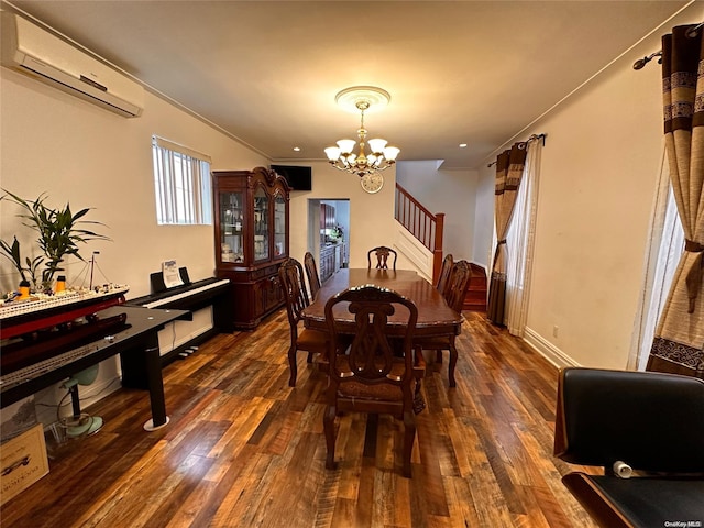 dining room with a wall mounted air conditioner, dark hardwood / wood-style flooring, ornamental molding, and an inviting chandelier