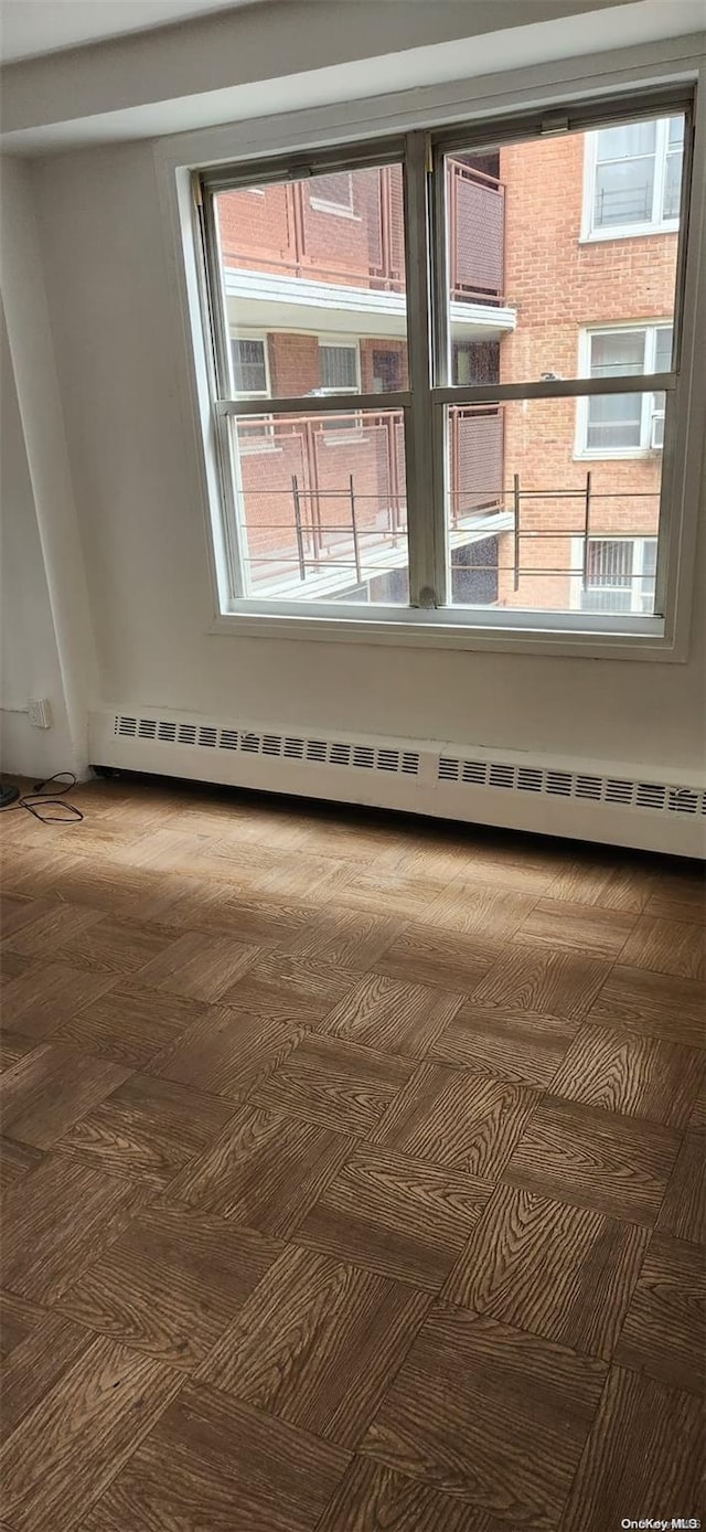 spare room featuring baseboard heating