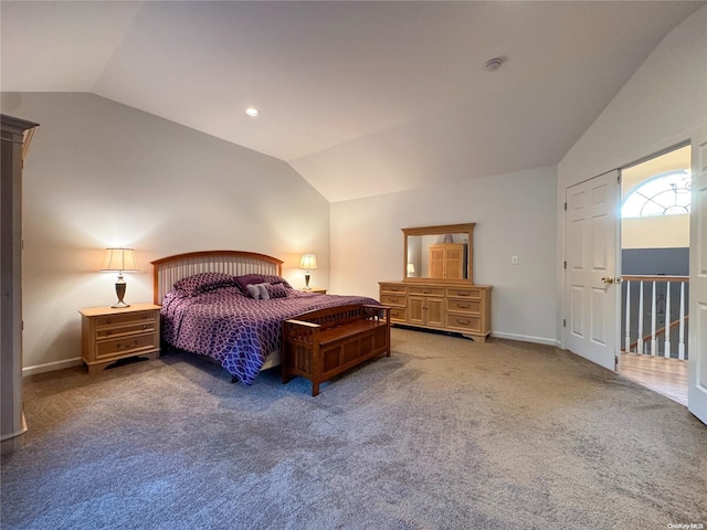 carpeted bedroom featuring vaulted ceiling