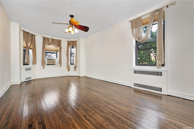 unfurnished living room featuring radiator, ceiling fan, dark wood-type flooring, and ornamental molding