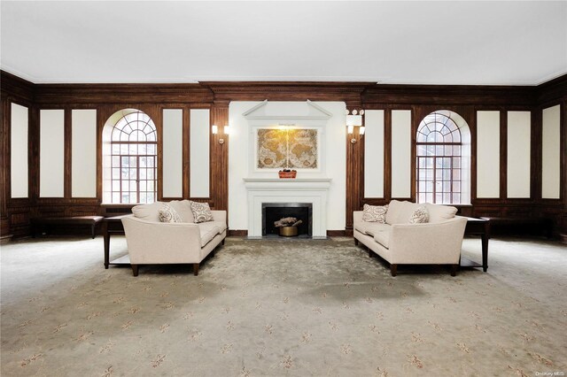 unfurnished living room with crown molding, plenty of natural light, and concrete floors