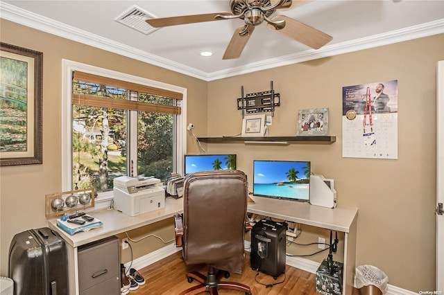 home office featuring crown molding, hardwood / wood-style floors, and ceiling fan