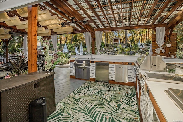 view of patio / terrace featuring an outdoor kitchen, ceiling fan, a pergola, and a wooden deck