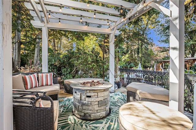 view of patio / terrace featuring a pergola and a fire pit