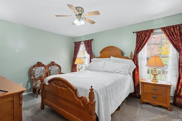 bedroom featuring ceiling fan and carpet