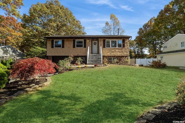 bi-level home with a front yard