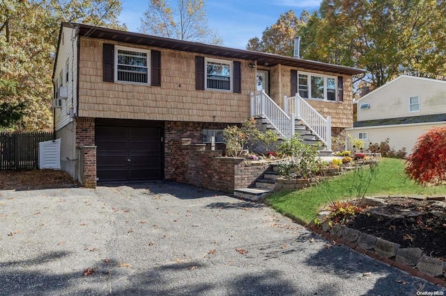 raised ranch featuring a garage