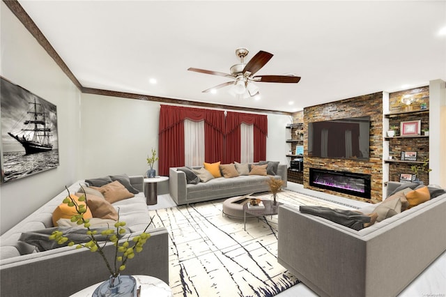 living room with ceiling fan and ornamental molding