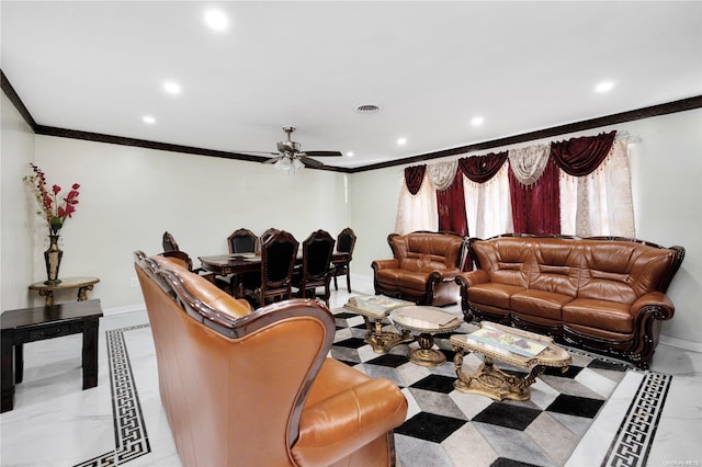 living room with ceiling fan and ornamental molding