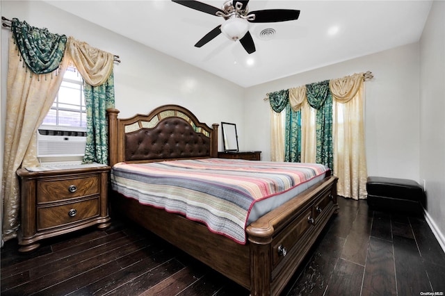 bedroom with ceiling fan, dark hardwood / wood-style flooring, and cooling unit