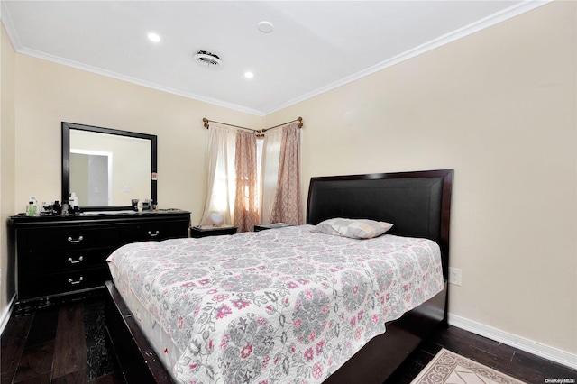 bedroom with ornamental molding and dark wood-type flooring