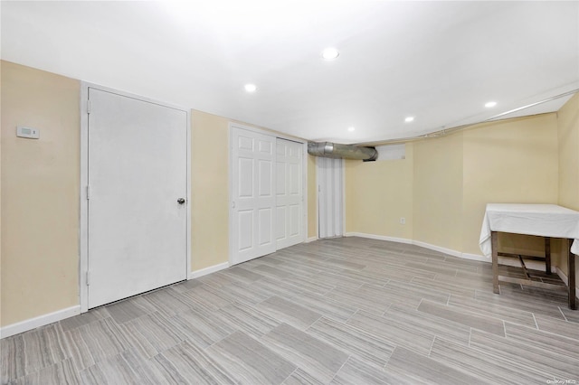 basement featuring light hardwood / wood-style flooring