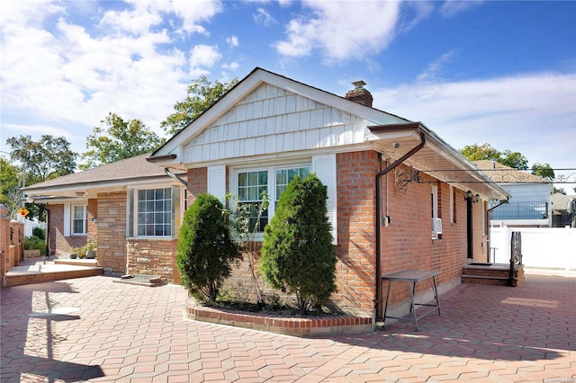 view of front of house with a patio area