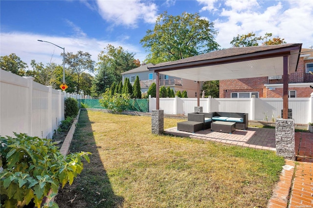 view of yard with outdoor lounge area and a patio area