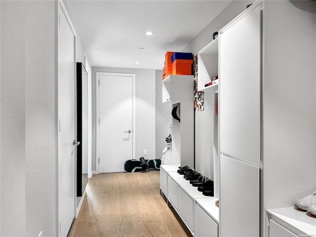 mudroom with light hardwood / wood-style flooring