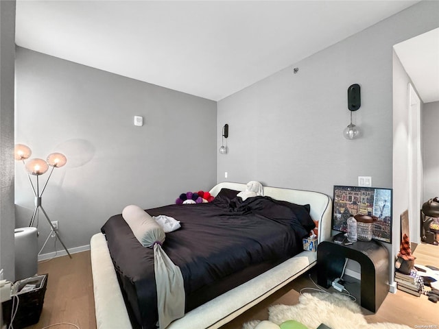 bedroom with hardwood / wood-style floors