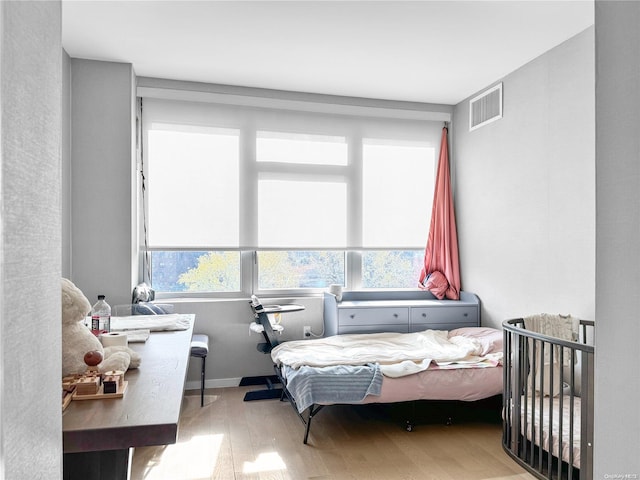 bedroom with light wood-type flooring