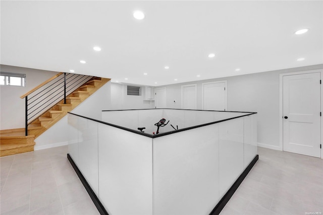 kitchen with white cabinets and light tile patterned flooring