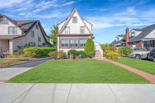 tudor house with a front yard