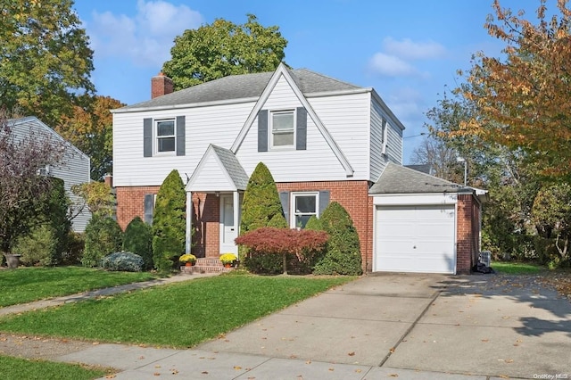 view of front of home featuring a front yard and a garage