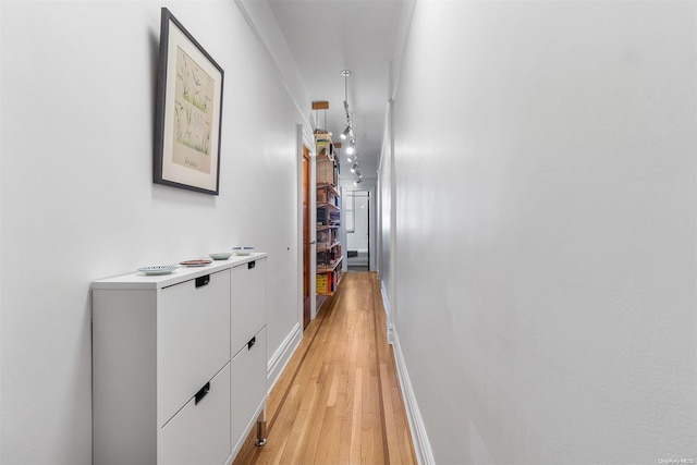 corridor with light wood-type flooring