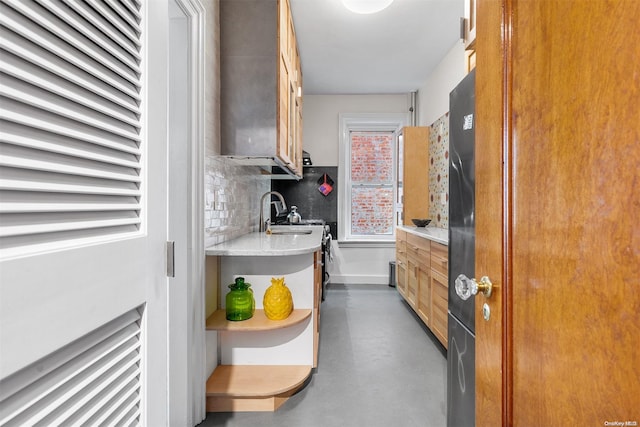 kitchen featuring backsplash and sink