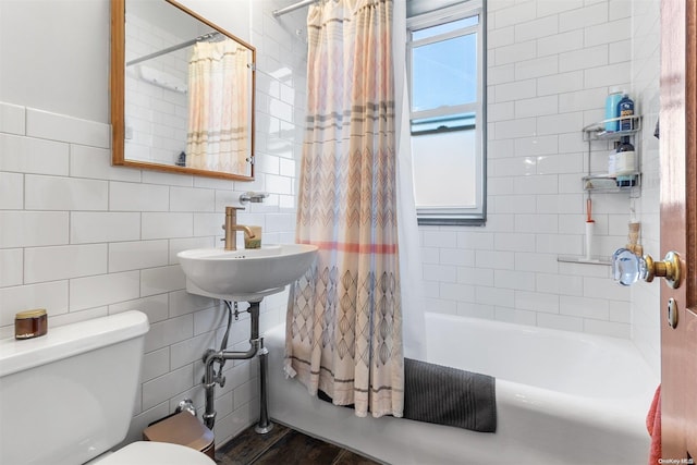 full bathroom with sink, tile walls, toilet, shower / tub combo, and hardwood / wood-style flooring